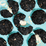 Cookies & Cream New York Cookie with black cocoa dough, white chocolate ganache, and Oreo crumbs by Crumbs & Doilies
